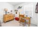 Spare bedroom with wood desk and dresser with decor at 2455 Alpine St, Longmont, CO 80504