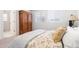 Bright bedroom with two windows and a decorative armoire at 2455 Alpine St, Longmont, CO 80504
