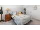 Bright bedroom with wood frame bed and a nightstand at 2455 Alpine St, Longmont, CO 80504