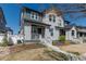 Charming two-story home with Hardie board siding, welcoming front porch, and professional landscaping at 2455 Alpine St, Longmont, CO 80504