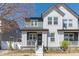 Charming two-story home with Hardie board siding, welcoming front porch, and professional landscaping at 2455 Alpine St, Longmont, CO 80504