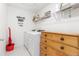 Laundry room with washer, dryer, and storage at 2455 Alpine St, Longmont, CO 80504