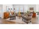 Cozy living room with ample natural light, stylish armchairs, a comfortable sofa, and tasteful decor at 2455 Alpine St, Longmont, CO 80504