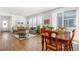 Spacious living room with hardwood floors, natural light, and views to an outdoor patio at 2455 Alpine St, Longmont, CO 80504