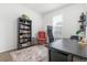 Functional home office with ample desk space, a comfortable chair, and a well-stocked bookcase at 2455 Alpine St, Longmont, CO 80504