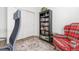 Well-lit home office featuring a large bookcase, comfortable seating, and a peaceful workspace at 2455 Alpine St, Longmont, CO 80504