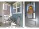 Inviting porch area with comfortable seating, perfect for enjoying the outdoors and neighborhood views at 2455 Alpine St, Longmont, CO 80504