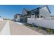 Modern townhomes feature attached garages and fenced yards along a quiet street at 2455 Alpine St, Longmont, CO 80504