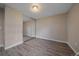 Neutral bedroom with modern gray floors and large mirrored closet providing ample storage at 4110 Hale Pkwy # 1E, Denver, CO 80220