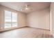 Spacious bedroom with large window and ceiling fan at 12983 W Ida Ave # 400, Littleton, CO 80127