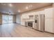 Modern kitchen with stainless steel appliances and white cabinets at 12983 W Ida Ave # 400, Littleton, CO 80127