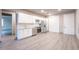 Modern kitchen features white cabinets and stainless steel appliances at 12983 W Ida Ave # 400, Littleton, CO 80127