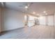 Open living room with wood-look floors and kitchen view at 12983 W Ida Ave # 400, Littleton, CO 80127