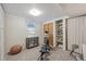 Home exercise room with fitness machine, closet, built-in shelving, and ample natural light at 1634 S Yukon Ct, Lakewood, CO 80232