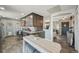 Modern kitchen featuring granite countertops, dark wood cabinets, and stainless steel appliances at 1634 S Yukon Ct, Lakewood, CO 80232