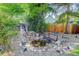 Backyard featuring a small pond, bridge and greenery at 6055 W Warren, Lakewood, CO 80227