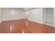 Spacious finished basement area with neutral walls and wood-look flooring at 6055 W Warren, Lakewood, CO 80227