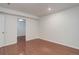 Finished basement featuring neutral walls and flooring at 6055 W Warren, Lakewood, CO 80227