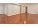 Spacious basement with wood flooring and neutral walls is ready for your personalized touches at 6055 W Warren, Lakewood, CO 80227