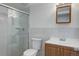 Bathroom with a glass shower, toilet, and vanity at 6055 W Warren, Lakewood, CO 80227