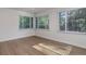 Bedroom with new hardwood flooring and large windows at 6055 W Warren, Lakewood, CO 80227