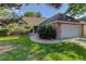 Charming brick home featuring a well-maintained lawn and an attached two-car garage at 6055 W Warren, Lakewood, CO 80227