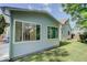 Exterior shot showcasing the side of the home and yard at 6055 W Warren, Lakewood, CO 80227