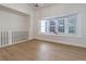 Cozy and well-lit living room with a bay window and modern flooring at 6055 W Warren, Lakewood, CO 80227