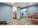 Finished basement featuring wood-look floors, bathroom, and kitchenette at 9976 Pitkin St, Commerce City, CO 80022