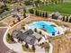 Aerial view of community pool, playground, and other recreational amenities, offering a variety of activities for residents at 9976 Pitkin St, Commerce City, CO 80022