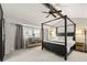 Spacious main bedroom with a large four-poster bed and plenty of natural light at 1640 W 113Th Ave, Denver, CO 80234