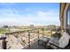 Enjoy city views from the balcony with stylish seating and glass railings at 5455 Landmark Pl # 1116, Greenwood Village, CO 80111