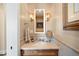 Stylish bathroom vanity with marble countertop and decorative lighting fixtures at 5455 Landmark Pl # 1116, Greenwood Village, CO 80111