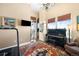 Bright bonus room with a piano, treadmill, and large windows at 5455 Landmark Pl # 1116, Greenwood Village, CO 80111