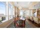 Formal dining room featuring hardwood floors, large windows with views, and a grand chandelier at 5455 Landmark Pl # 1116, Greenwood Village, CO 80111