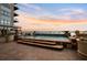 Rooftop hot tub area with scenic views of the water, mountains, and beautiful sunset at 5455 Landmark Pl # 1116, Greenwood Village, CO 80111