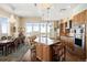 Gourmet kitchen boasts granite countertops, stainless appliances, and an island with bar seating at 5455 Landmark Pl # 1116, Greenwood Village, CO 80111