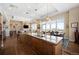 Gourmet kitchen with granite countertops, stainless steel appliances, and a large island at 5455 Landmark Pl # 1116, Greenwood Village, CO 80111