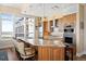 Modern kitchen featuring granite countertops, stainless steel appliances, and bar seating at 5455 Landmark Pl # 1116, Greenwood Village, CO 80111