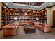Classic library with bookshelves, comfortable leather sofas, and a warm, inviting atmosphere at 5455 Landmark Pl # 1116, Greenwood Village, CO 80111