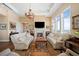 Inviting living room with large windows, fireplace, and elegant furnishings at 5455 Landmark Pl # 1116, Greenwood Village, CO 80111