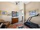 Cozy living area with a treadmill and colorful artwork on the walls at 5455 Landmark Pl # 1116, Greenwood Village, CO 80111