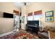 Elegant living room featuring a piano, chandelier, and bright windows with views at 5455 Landmark Pl # 1116, Greenwood Village, CO 80111