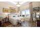 Serene main bedroom with ample natural light, stylish décor, and a comfortable seating area at 5455 Landmark Pl # 1116, Greenwood Village, CO 80111