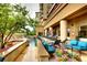 Relaxing pool area with waterfalls, lounge chairs, lush greenery, and a view of the building at 5455 Landmark Pl # 1116, Greenwood Village, CO 80111