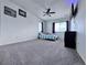 Bedroom with carpet, a ceiling fan, and a window with curtains and a view of the outside at 9923 Truckee St, Commerce City, CO 80022