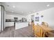 Bright kitchen with stainless steel appliances, hardwood floors, and a center island at 9923 Truckee St, Commerce City, CO 80022