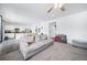 Living room flowing into the kitchen with modern appliances and a spacious island with counter seating at 9923 Truckee St, Commerce City, CO 80022
