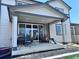 View of the covered patio with outdoor furniture and a nice outdoor space at 9923 Truckee St, Commerce City, CO 80022