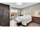 Bedroom with a hardwood floor, wooden furniture and a window with a view to the outside patio at 11865 Barrentine Loop, Parker, CO 80138